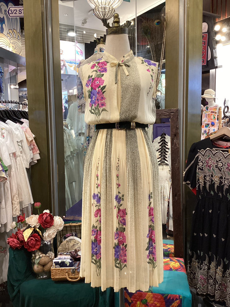 Mannequin wearing a floral dress in a store setting