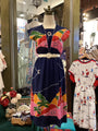Colorful dress on a mannequin with a patterned background