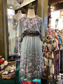Floral dress on a mannequin in a vintage clothing store