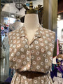 Floral patterned dress on a mannequin in a store setting