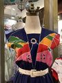 Colorful jacket with abstract patterns on a mannequin in a store setting