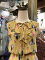 Colorful dress on a mannequin in a store setting