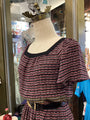Mannequin wearing a patterned top in a store setting