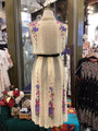 Mannequin wearing a floral dress in a store setting