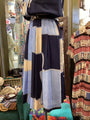 Vintage dress with geometric pattern on a mannequin in a store setting