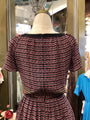Patterned dress on a mannequin in a store setting