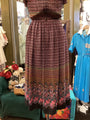 Patterned dress on a rack in a store with colorful background