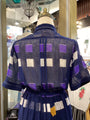 Traditional Japanese kimono with a blue and purple pattern on a mannequin.