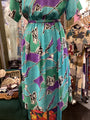 Colorful dress with butterfly pattern on a rack in a store