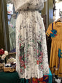 Floral dress on a mannequin with a colorful background