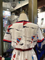 Traditional Japanese kimono with sailboat design on a mannequin in a store setting.