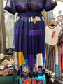 Colorful dress with geometric patterns in a store setting