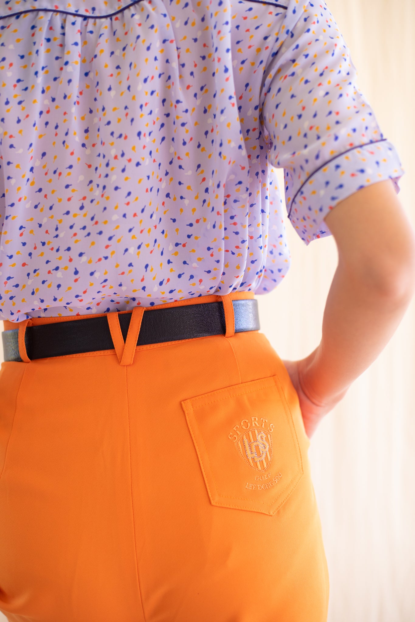 Orange high-waisted vintage trousers